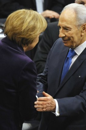 Impassioned speech ... Angela Merkel thanks Shimon Peres.