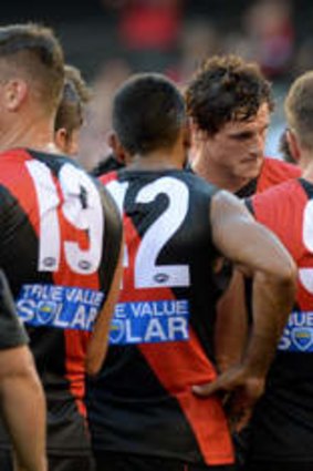 Bombers coach James Hird talks to his players.