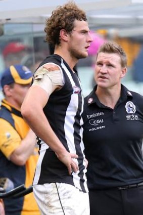Nathan Buckley has words with Jarrod Witts on the sidelines.