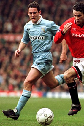 Ryan Giggs breaks away from Coventry City's Ally Pickering at Old Trafford in 1996.