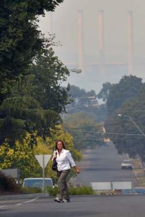 Ash rains down on Morwell from the coal mine fire as smoke covers the surrounding region.