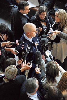 Victoria Police Chief Commissioner Simon Overland in the midst of a media scrum last week.