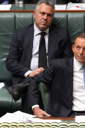 Teamwork: Treasurer Joe Hockey and Prime Minister Tony Abbott react to comments from Opposition Leader Bill Shorten.
