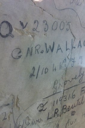 The scribbles that are the signatures and numbers of more than 150 World War II veterans on the Soldiers' Signatures Wall at Brisbane City Hall.
