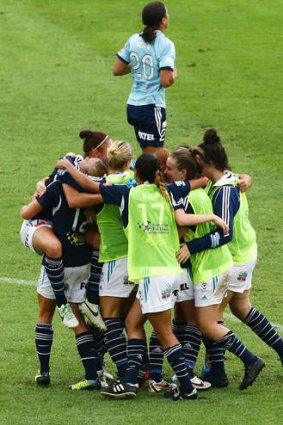 Final-bound: Melbourne Victory players celebrate victory over Sydney FC.