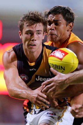 Steven Verrier of the Tigers is tackled during the exhibition match between the Richmond Tigers and the Indigenous All-Stars at Traeger Park in Alice Springs earlier this year. The game was not televised.