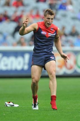 Sock it to 'em: Jack Viney goes with the one boot.