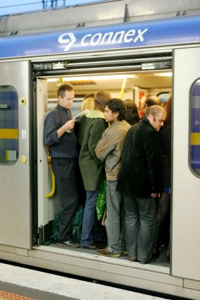 Standing room only: No respite yet for these passengers on a  crowded Melbourne commuter train.