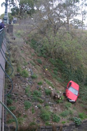 Close call: an Age reader took this photo after the car plunged off Heidelberg Road this morning.