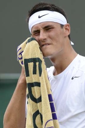Pat Rafter says Bernard Tomic didn't 'put in the work' before Wimbledon this year.