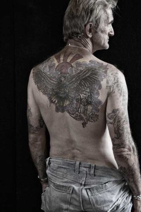 Known as 'Half", John Tjepkema shows the tattoo of an eagle on his back which to him represents freedom, not just from prison, but within himself.