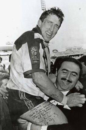 Support ... Arthur Coorey with Steve Mortimer after the 1985 grand final.