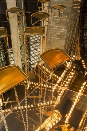 Detail of Carsten Holler's <i>Golden mirror carousel</i>.