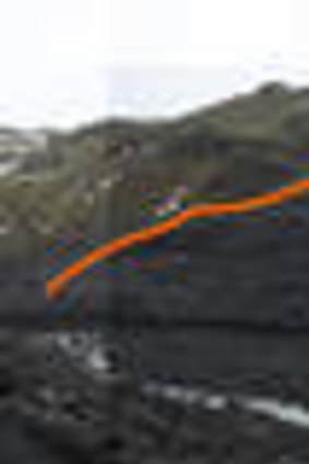 The Solheim Glacier in Iceland in February 2009, with its height in 2006 indicated by the orange line.