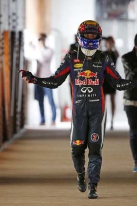 The pits: Mark Webber is not happy as he walks back after his car caught fire.