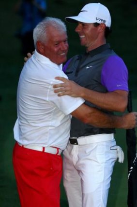 Rory McIlroy celebrates his one-stroke victory with his father, Gerry.