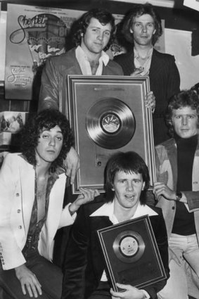 Australian  pop group Sherbet, with their gold single for their record <i>Howzat</i> in 1976. From left to right, Alan Sandow, Harvey James, Tony Mitchell, Garth Porter and Daryl Braithwaite.