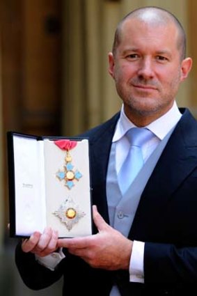 Apple's chief designer Sir Jonathan Ive, poses for pictures with with his Knight Commander medal in London this week.