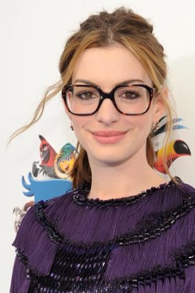 Specs appeal: Anne Hathaway is fashionably framed by her chunky glasses.