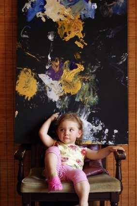 Portrait of the young artist: Aelita Andre, 2, with one of her paintings.