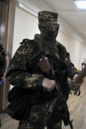 A separatist fighter inside Donetsk's regional government building.