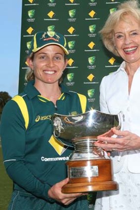 Governor-General Quentin Bryce and Australian captain Jodie Fields pose with the Rose Bowl after Australia won game four of the one-day international series against New Zealand on Wednesday.