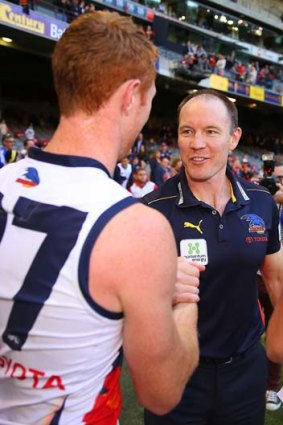 Crows coach Brenton Sanderson congratulates Tom Lynch after the win over the Western Bulldogs in round six.