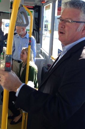 Former WA treasurer Troy Buswell getting acquainted with public transport.