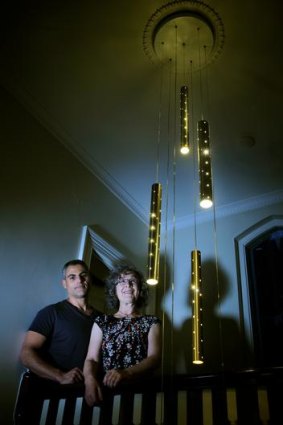Lighting designer Ilan El with client Alex Caldwell and the Rain light he created for her.