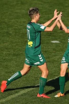 Canberra United's Michelle Heyman and Ashleigh Sykes celebrate a goal  during their round one win over the Western Sydney Wanderers.