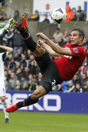 Thing of beauty: Manchester United's Dutch striker Robin van Persie scores Manchester United opening goal in their 4-1 rout of Swansea City.