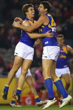 Dean Cox (right) celebrates a goal with Jamie Cripps during the round 21 game against Essendon on Saturday.