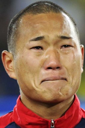 Crying his eyes out ... North Korea's star player broke down during the national anthem.