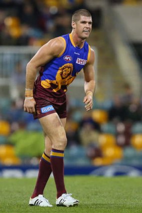 Jonathan Brown limps off the field during the win against St Kilda at the Gabba.