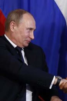 Mr Obama and Mr Putin shake hands in Los Cabos, Mexico, last year.