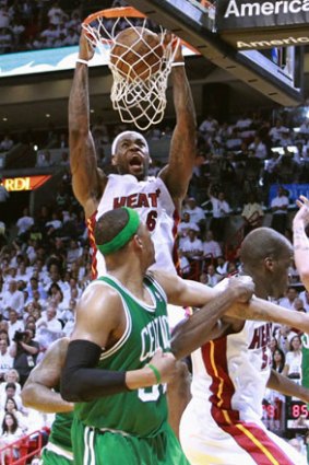 Miami Heat’s LeBron James sails to the hoop against Boston.