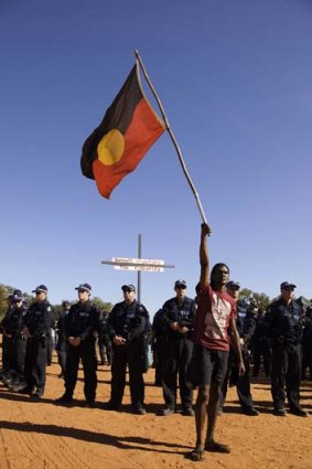 Police watch as during a protest against plans to develop a gas hub at James Price Point near Broome in WA.