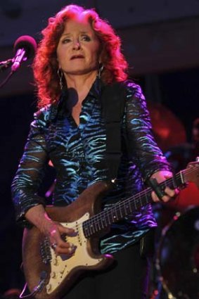 Roots united: American blues singer-songwriter and slide guitar player Bonnie Raitt on stage in Singapore last month.