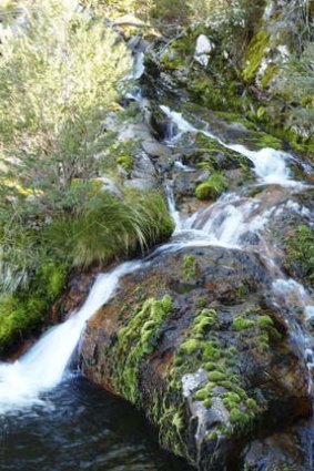 Water cascades into a small dam along the Deep Creek Aqueduct en route to the wreck.