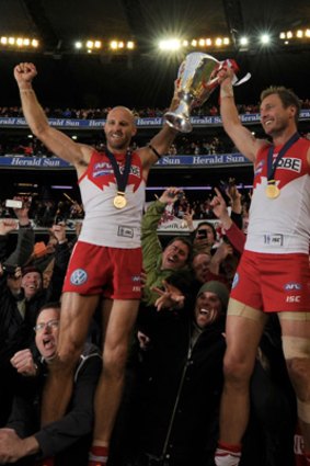 Up for the cup: Jarrad McVeigh and Jude Bolton celebrate.