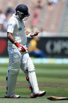 Just what the doctor ordered ... Dhammika Prasad of Sri Lanka injured a finger off the bowling of Mitchell Johnson in the second Test.