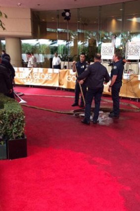 Red carpet nightmare: the clean-up operation.