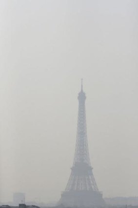The Eiffel Tower in thick smog.