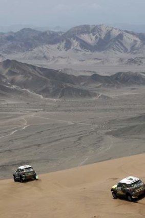 Out in front: France's Stephane Peterhansel (L) leads Spain's Nani Roma during the 12th stage of the Dakar Rally from El Salvador to La Serena, Chile.
