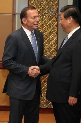 Prime Minister Tony Abbott meets Chinese President Xi Jinping.