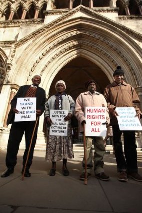 Wambugu Wa Nyingi, Jane Muthoni, Paulo Nzili and Ndiku Mutua stand outside the High Court in London. The four Kenyans are taking the British government to court over allegations that they were tortured during the Mau Mau uprising when Britain was the colonial power.