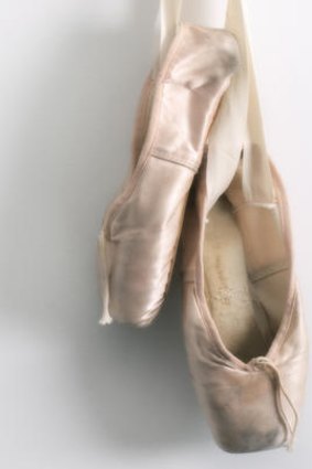 Well-worn ballet shoes.