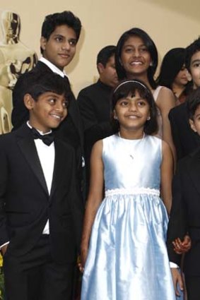 Cast of <em>Slumdog Millionaire</em>: (From left) Azharuddin Mohammed Ismail, Rubina Ali, Ayush Mahesh Khedekar, (back left) Ashutosh Lobo Gajiwala, Tanvi Ganesh Lonkar and Tanay Hemant Chheda arrive at the Oscars in 2009.