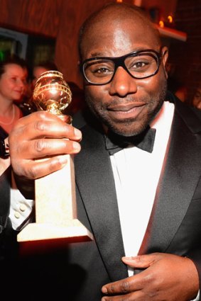 <i>12 Years a Slave</i> director Steve McQueen with the Golden Globe for best picture (drama).