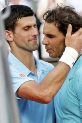 Novak Djokovic congratulates an emotional Rafael Nadal after their men's singles final at Roland Garros.